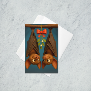 A holiday card featuring two bats smiling at each other as they hang from a branch with mistletoe between the two of them.